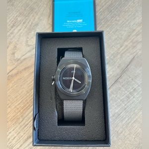 NWT Nixon Light-wave watch in all black, size is adjustable.
